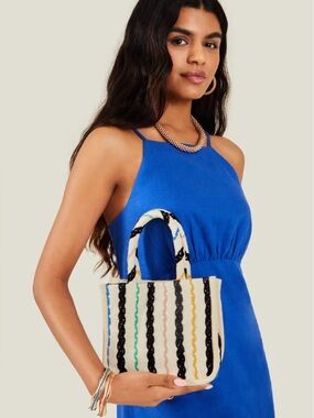 Woven striped cotton canvas handbag features a detachable crossbody strap NWT